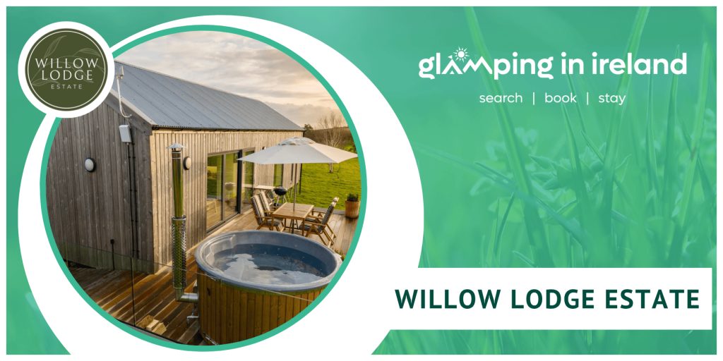 Log cabin with hot tub and patio furniture on raised decking at Willow Lodge Estate in County Down
