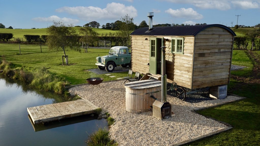 Stunning shepherd a hut, with a lakeside view and panoramic rural views, located at Four Acres Farm