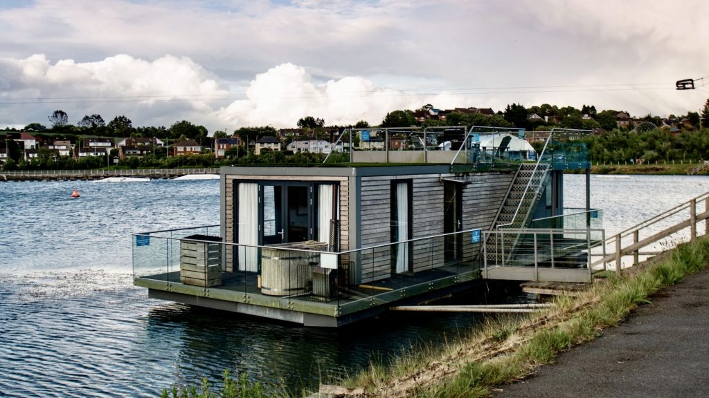 Luxury Boat House sitting on the water, with a Lakeview at Waters Edge Retreat in County Down.